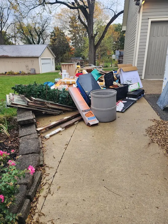 Dumpster being loaded with debris for Commercial Dumpster Rental in Paramount